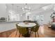 Open-concept dining and living area, featuring modern lighting and comfortable seating at 5300 Peachtree Rd # 1212, Atlanta, GA 30341