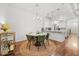 Cozy dining area with a modern chandelier and a view of the adjacent kitchen at 5300 Peachtree Rd # 1212, Atlanta, GA 30341
