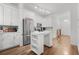 Chic kitchen featuring white cabinets, stainless steel appliances, and a kitchen island at 5300 Peachtree Rd # 1212, Atlanta, GA 30341