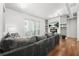 Comfortable living room with a modern fireplace, TV, and plush gray sectional sofa at 5300 Peachtree Rd # 1212, Atlanta, GA 30341
