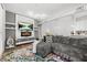 Inviting living room with fireplace, TV, and comfortable gray sectional sofa at 5300 Peachtree Rd # 1212, Atlanta, GA 30341