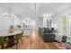 Bright living room featuring an open layout, modern lighting, and an inviting gray sofa at 5300 Peachtree Rd # 1212, Atlanta, GA 30341