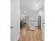Open floor plan connecting living room and kitchen with stainless appliances and wine rack at 5300 Peachtree Rd # 1212, Atlanta, GA 30341