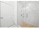 Modern bathroom featuring walk-in shower with glass door and stone floor at 5300 Peachtree Rd # 1212, Atlanta, GA 30341