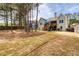 Large backyard with a lawn, trees, fencing, and a view of the deck at 161 Dorys Way, Dallas, GA 30157