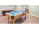 Basement with pool table, air hockey table, and bar area for entertainment at 161 Dorys Way, Dallas, GA 30157