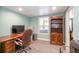 Finished basement office space with desk, shelving, and tiled flooring at 161 Dorys Way, Dallas, GA 30157
