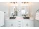 Bathroom featuring double sinks, modern fixtures, and a spacious vanity at 161 Dorys Way, Dallas, GA 30157