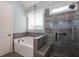 Beautiful bathroom featuring a tub, walk-in shower, and tile flooring providing the ultimate spa-like experience at 161 Dorys Way, Dallas, GA 30157