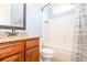 Bathroom with shower stall, wood vanity, and modern fixtures at 161 Dorys Way, Dallas, GA 30157