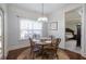 Cozy breakfast nook features a round table, wood floors, and natural light from the nearby window at 161 Dorys Way, Dallas, GA 30157