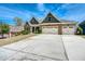 Charming home with a three-car garage, stone accents, and a well-manicured lawn at 161 Dorys Way, Dallas, GA 30157