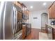 Modern kitchen with stainless steel appliances, granite countertops, and hardwood floors at 161 Dorys Way, Dallas, GA 30157