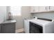 Bright laundry room with modern appliances and storage at 161 Dorys Way, Dallas, GA 30157