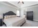 Bright main bedroom featuring a trey ceiling and a view into the ensuite bath at 161 Dorys Way, Dallas, GA 30157