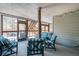 Spacious covered patio with ample seating, a hot tub, and access to the backyard at 161 Dorys Way, Dallas, GA 30157
