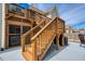 Exterior staircase connecting the patio to the upper deck of the house at 161 Dorys Way, Dallas, GA 30157