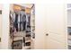 Organized walk-in closet with built-in shelves and ample storage space at 161 Dorys Way, Dallas, GA 30157
