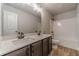 Bathroom features a double vanity, a toilet, and a tub/shower combination at 210 Pinewood Dr, Covington, GA 30014