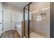 Bathroom featuring a glass shower, soaking tub, and tiled walls at 210 Pinewood Dr, Covington, GA 30014