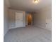 A carpeted bonus room features neutral walls and a storage closet at 210 Pinewood Dr, Covington, GA 30014