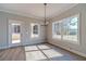 Bright dining room with large windows and a glass patio door at 210 Pinewood Dr, Covington, GA 30014