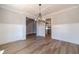 Dining room featuring wainscotting, hardwood floors, and stylish chandelier at 210 Pinewood Dr, Covington, GA 30014