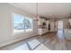 Bright dining room overlooking yard and open kitchen with granite countertops at 210 Pinewood Dr, Covington, GA 30014