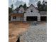 New construction home featuring a two-story design and an attached two-car garage at 210 Pinewood Dr, Covington, GA 30014