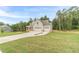 Beautiful two-story home featuring an attached two-car garage surrounded by lush trees at 210 Pinewood Dr, Covington, GA 30014
