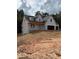 New construction home featuring a two-story design and an attached two-car garage at 210 Pinewood Dr, Covington, GA 30014