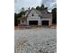 New construction home featuring a two-story design and an attached two-car garage at 210 Pinewood Dr, Covington, GA 30014