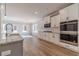 Modern kitchen featuring stainless steel appliances, white cabinets, and granite countertops at 210 Pinewood Dr, Covington, GA 30014