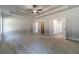 Spacious bedroom features a tray ceiling, fan, carpet, and neutral paint at 210 Pinewood Dr, Covington, GA 30014