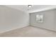 Bright bedroom features neutral walls, carpet, and a window for natural light at 2390 Lawrenceville Hwy # K, Decatur, GA 30033
