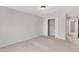Neutral bedroom boasts a carpeted floor and convenient closet with double doors at 2390 Lawrenceville Hwy # K, Decatur, GA 30033