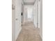 Hallway with neutral carpet, leading to various rooms, showcasing accessibility at 2390 Lawrenceville Hwy # K, Decatur, GA 30033