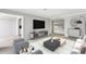 Open-concept living room showcasing contemporary furnishings, an entertainment center, and a seamless design at 2390 Lawrenceville Hwy # K, Decatur, GA 30033