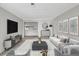 Spacious living room featuring modern decor, comfortable seating, and seamless open floor plan at 2390 Lawrenceville Hwy # K, Decatur, GA 30033