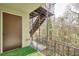 Outdoor patio with railing, artificial turf, and access to stairs, creating a private retreat at 2390 Lawrenceville Hwy # K, Decatur, GA 30033