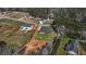Aerial view of a home on a spacious lot, surrounded by lush greenery and other residential properties at 25 Fourwood Dr, Covington, GA 30016