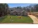 Sprawling lawn surrounds this brick home with long driveway at 25 Fourwood Dr, Covington, GA 30016