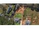 Aerial view of a property featuring a modern home on a tree-lined lot at 25 Fourwood Dr, Covington, GA 30016