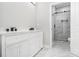 Bathroom featuring double vanity with marble counters, and large marble shower at 25 Fourwood Dr, Covington, GA 30016