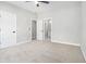 Bedroom with carpet and freshly painted with adjacent bathroom access at 25 Fourwood Dr, Covington, GA 30016
