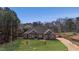 Beautiful brick home with a well-manicured lawn and an inviting entryway at 25 Fourwood Dr, Covington, GA 30016