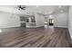 Open-concept living space flows to the kitchen with stylish pendant lighting at 25 Fourwood Dr, Covington, GA 30016