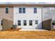 Exterior view of the back of the house with a patio and a fenced yard at 125 Priestwood Ln, Acworth, GA 30102