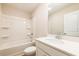 Bright bathroom with a white tub/shower combo, single sink vanity, and tile floor at 125 Priestwood Ln, Acworth, GA 30102