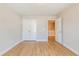 Cozy bedroom with hardwood floors, a double door closet, and an open door leading to another room at 125 Priestwood Ln, Acworth, GA 30102